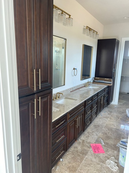 master bath natural stone vanity by WoodArt Cabinets