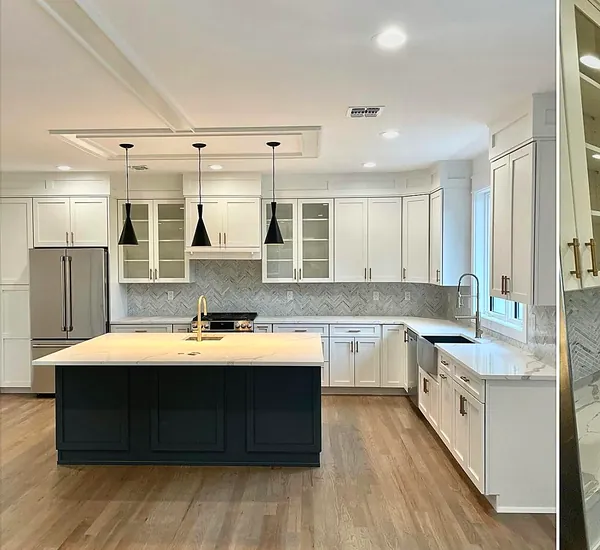 White kitchen with blue island and gold hardware by WoodArt Cabinets San Antonio