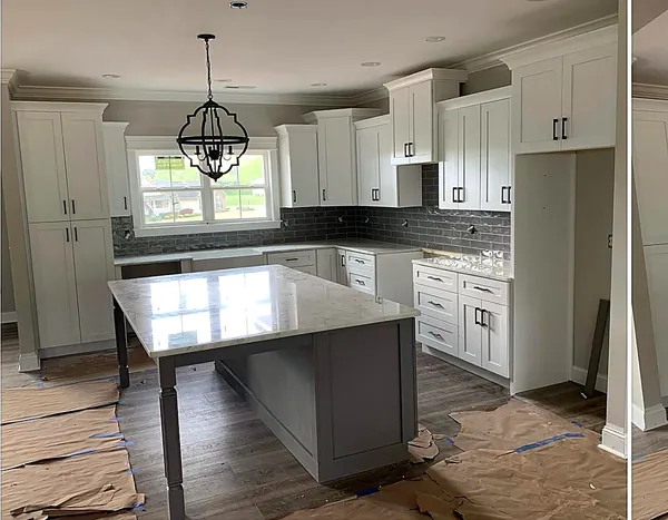 white kitchen with gray island and subway backsplash by WoodArt Cabinets San Antonio