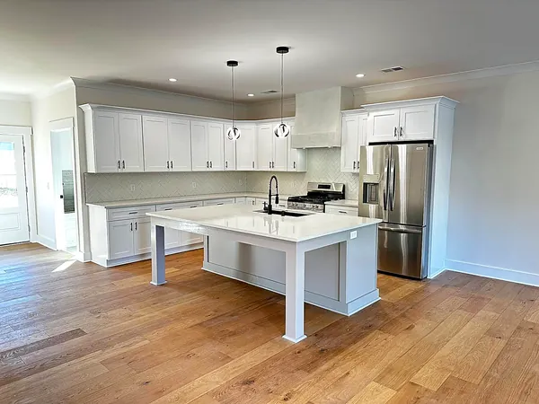 white shaker kitchen with island and stainless appliances by WoodArt Cabinets San Antonio